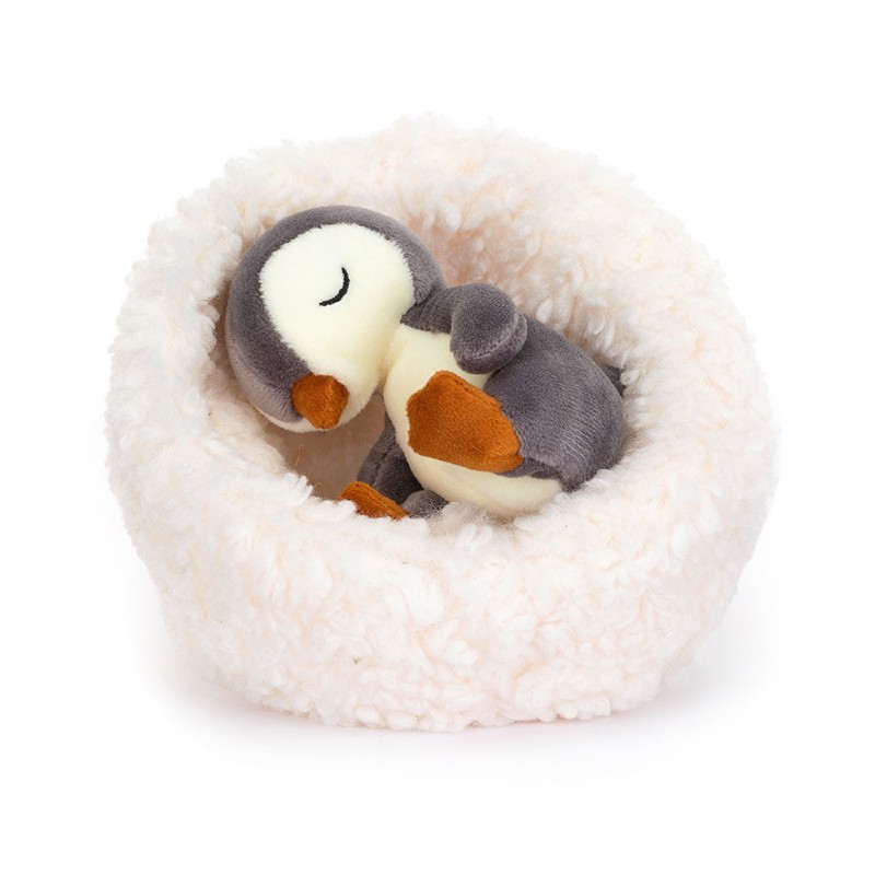 Peluche pingouin et son nid
